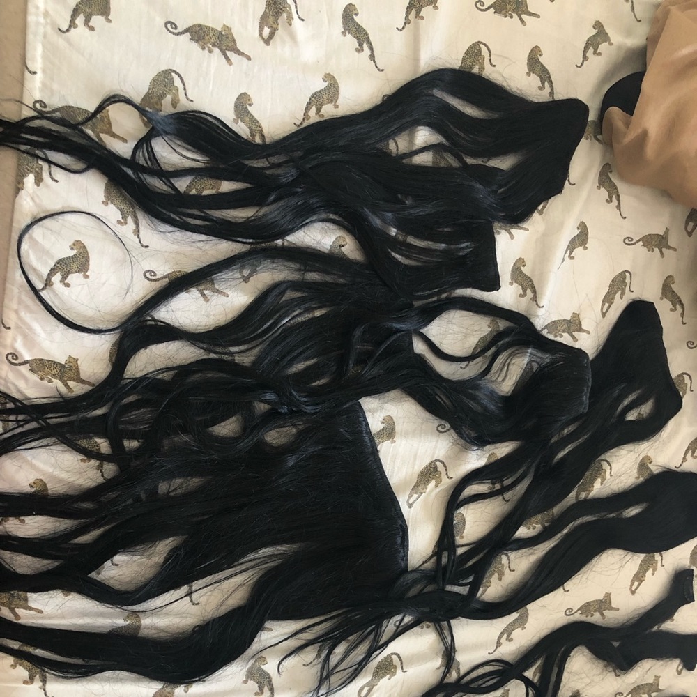 Black clip in real hair extensions